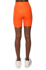 RIO FAUX LEATHER BIKER SHORT IN ORANGE
